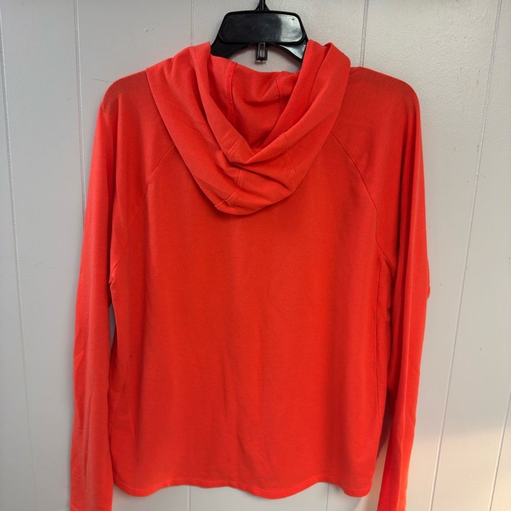 Under Armour Women's Pindot Hoodie-Graphic in a vibrant orange or coral color. - Picture 3 of 5